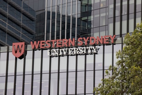 A building with a red and white sign reading “Western Sydney University”.