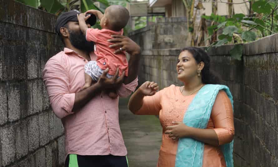 Anupama and Ajith playing with their son Aiden, near their house in Thiruvananthapuram, Kerala