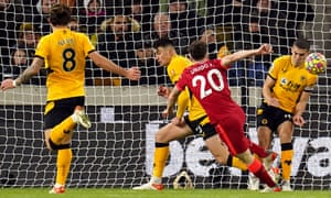 Liverpool’s Diogo Jota sees his shot blocked on the line by Wolverhampton Wanderers’ Conor Coady (right) d