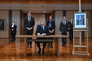 Australian Prime Minister Anthony Albanese signs the condolence book for Queen Elizabeth II at Parliament House in Canberra.