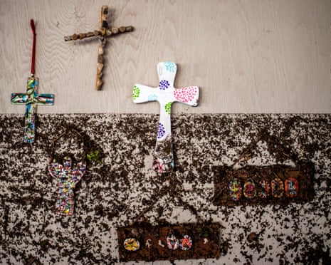 Crosses hang on a wall with flood marks at Camp Mystic, in the aftermath of deadly flooding in Kerr County.