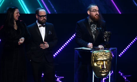 Laurence Phillips (right) from Poncle Studio accepts the game design award for Vampire Survivors at the 2023 Bafta Games Awards, held at Queen Elizabeth Hall, London on 30 March.
