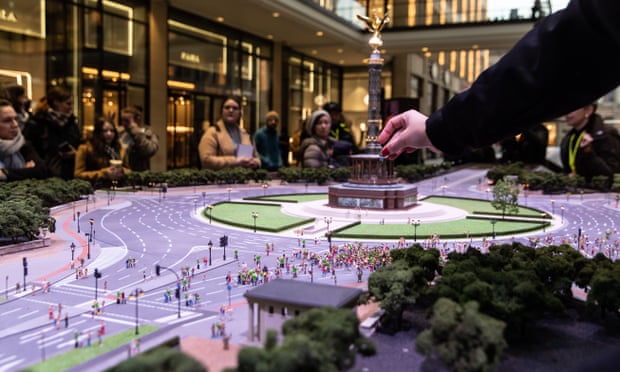 Workers from the Rave The Planet organisation set up a miniature model of Berlin’s Strasse des 17 Juni boulevard and Victory Column.