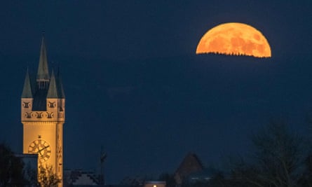A supermoon rises behind the Bavarian forest near Straubing in southern Germany.