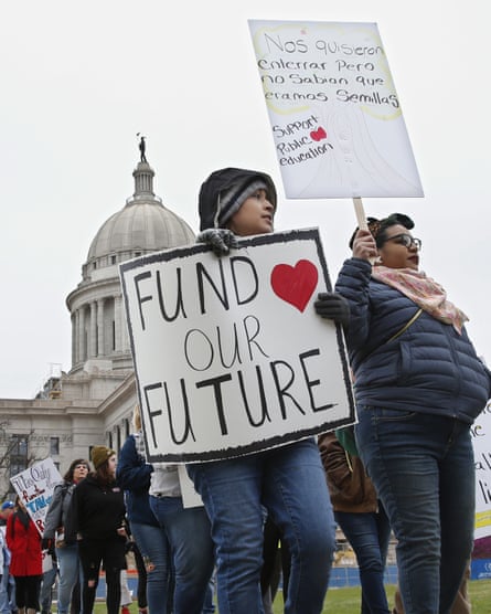 Teachers rally against low school funding outside the Oklahoma state capitol on 2 April.