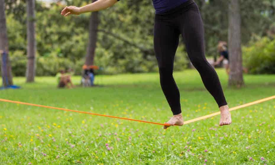 tightrope with woman balanced on it