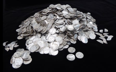 Old silver coins in a pile