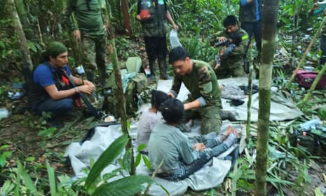 Colombian soldiers attend to the children rescued from the plane that crashed in the jungle of Caqueta.