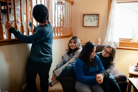 Ted (16), Kimberly (10), and Janet Kobylecky (12) with their mother in the home they share with Tom’s father, in New Lenox, Illinois.