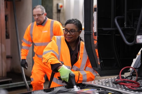 Kemi Badenoch using equipment at the Flannery Plant Hire in Wembley.