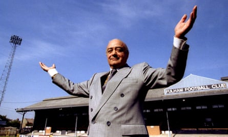 Mohammed Al Fayed stands in front of the east stand of Craven Cottage, home of Fulham