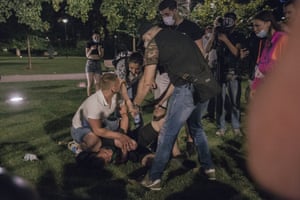 A protester in Belgrade receives first aid help. The number of injured protesters has not been reported.