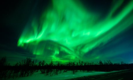 The aurora borealis, commonly known as the northern lights, are seen in the sky above Kiruna, Sweden.