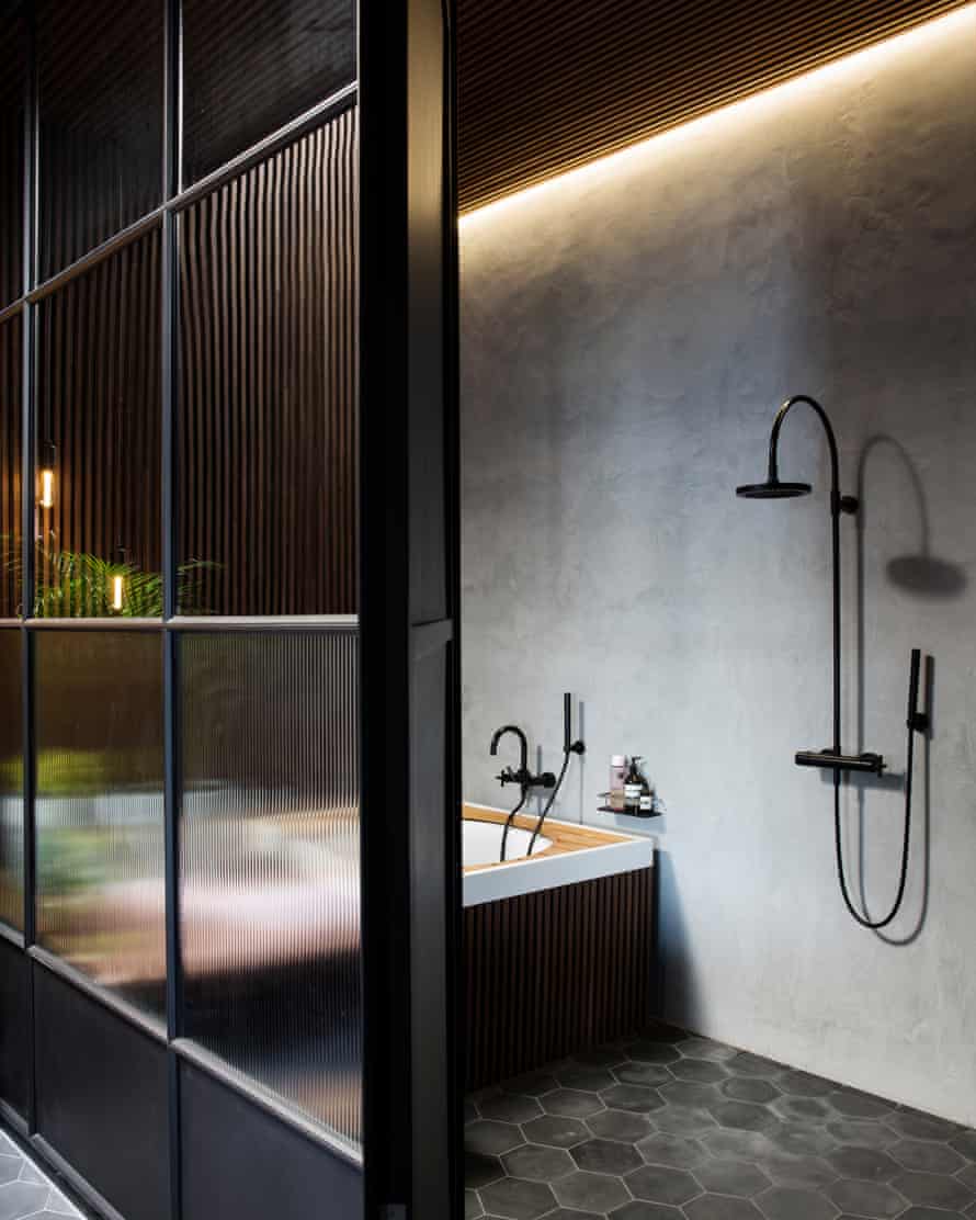 Industrial chic: the dark-hued bathroom.