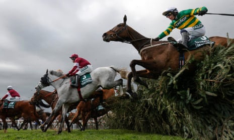 Paul Townend and I Am Maximus (right) jump the Chair on their way to winning the Grand National.