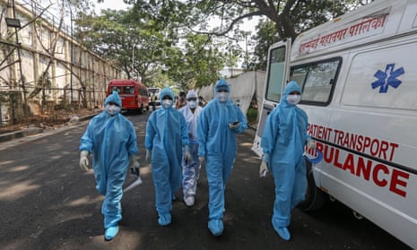 Health workers arrive to start their shift at a Covid-19 centre in Mumbai
