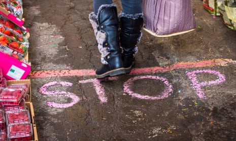 ‘Stop’ chalked on the floor of a fruit and vegetable shop