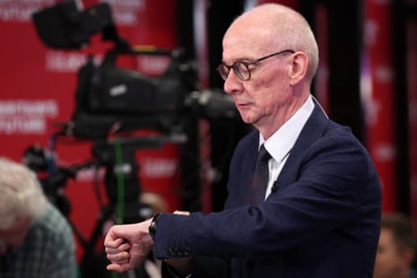 Pat McFadden checking his watch before an interview this morning.