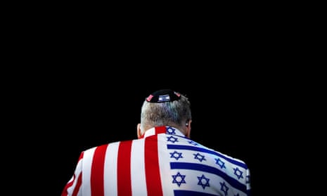 A member of the audience looks on wearing a US-Israel themed custom suit during the Aipac convention in Washington DC, in March 2020.