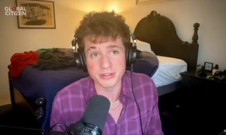 Musician Charlie Puth with his unmade bed in the background.