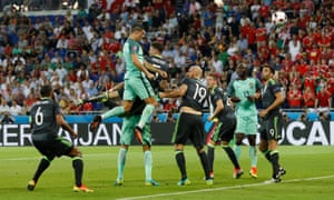 The Wales defence can only watch as Cristiano Ronaldo heads in the opening goal of the Euro 2016 semi-final for Portugal.