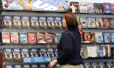 woman browsing videos connected a shelf