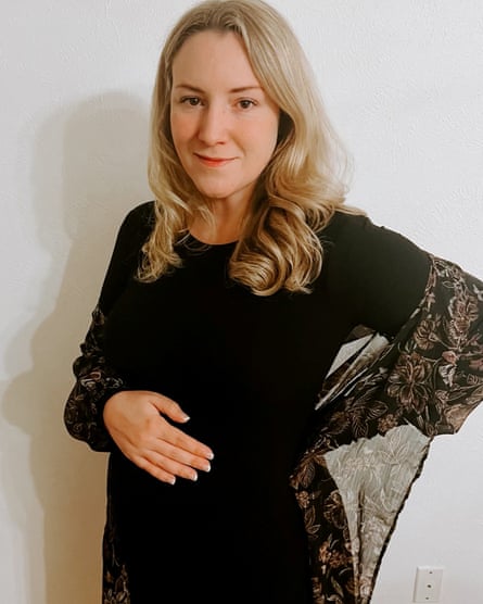 blonde pregnant woman wearing black