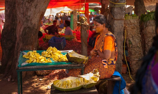 A woman sells jackfruit in a market in Karaikudi, Tamil Nadu.