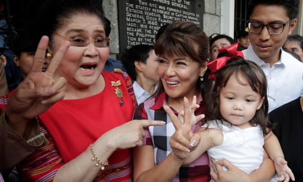 Imee Marcos (centre in checked shirt) pictured in Manila last year with her mother, the former first lady Imelda Marcos.