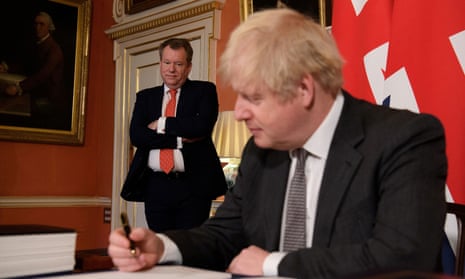 UK chief negotiator David Frost looks on as Boris Johnson poses for a picture after signing the Brexit trade deal with the EU on 30 December, 2020.