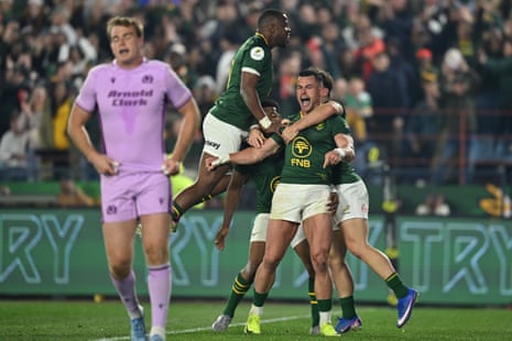 Jesse Kriel of South Africa celebrates with teammates after scoring their team's sixth try.