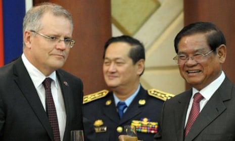 Scott Morrison, the then immigration minister, and Cambodia’s interior minister, Sar Kheng, sharing a toast in Phnom Penh
