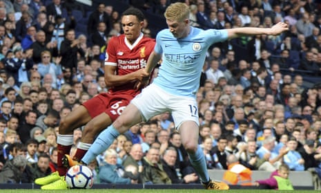 Liverpool’s Trent Alexander-Arnold, left, and Manchester City’s Kevin De Bruyne, right, challenge for the ball during the English Premier League soccer match at the Etihad Stadium Saturday, Sept. 9, 2017