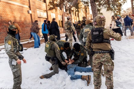 Officers arrest a man on the ground