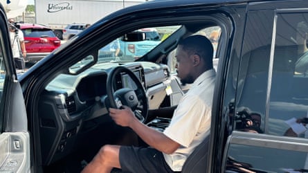 Richard Pryor sits behind the wheel of a new 2025 Ford F-150 pickup.