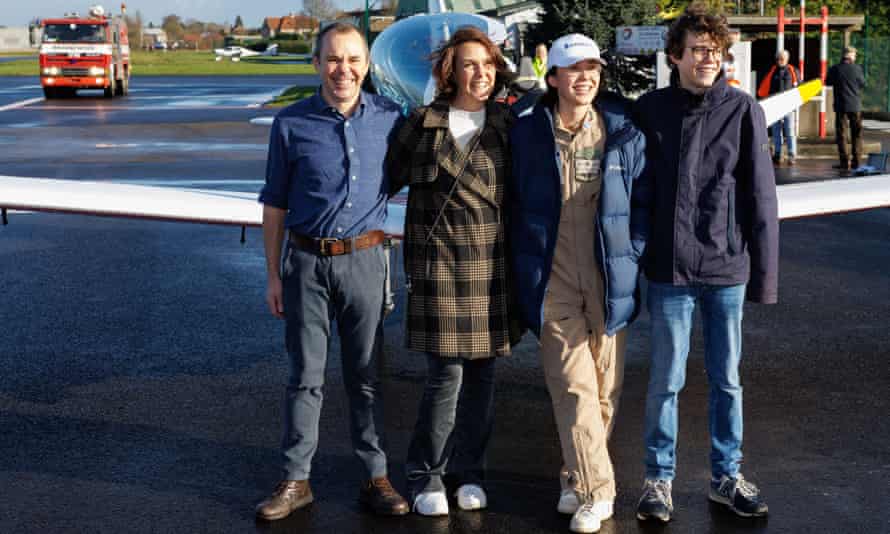 Zara Rutherford with her parents, Sam Rutherford and Beatrice De Smet, and her brother at Wevelgem airfield in Belgium.