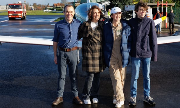 Zara Rutherford with her parents, Sam Rutherford and Beatrice De Smet, and her brother at Wevelgem airfield in Belgium.