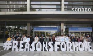 Greenpeace members gather while the Intergovernmental Panel on Climate Change, IPCC, hold a press conference in Incheon, South Korea, on 8 October.