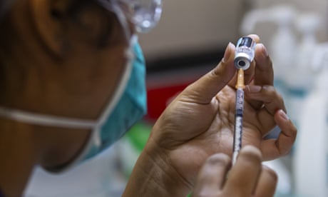 A health care worker prepares a Pfizer vaccine in the pharmacy of the Heidelberg Repatriation Hospital vaccination hub in Melbourn