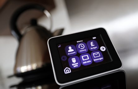 An energy smart meter in front of a kettle