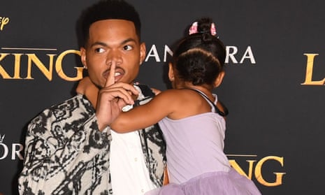 Chance the Rapper with his daughter at The Lion King premiere.