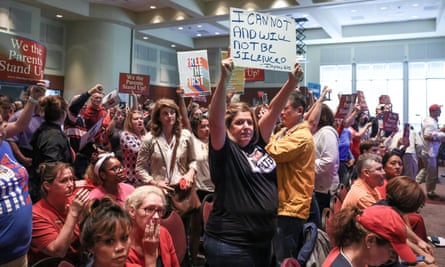 Parents and community members protest at a Loudoun county school board meeting in Ashburn, Virginia, last week.