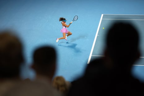 Spectators watch Emma Raducanu fire off a return to Coco Gauff.