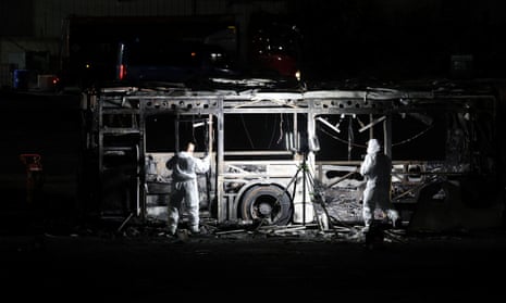 Forensics personnel inspect a bus on Friday after an explosion in Bat Yam, south of Tel Aviv