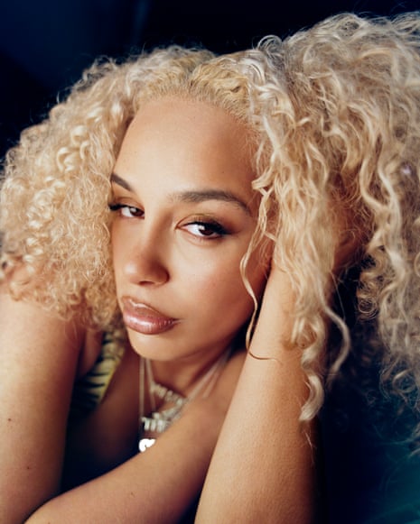 Jorja Smith lying down lokoing at the camera