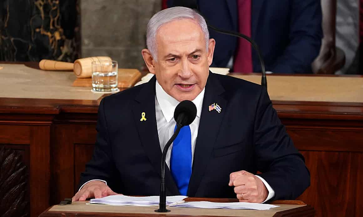 Benjamin Netanyahu speaks into a microphone