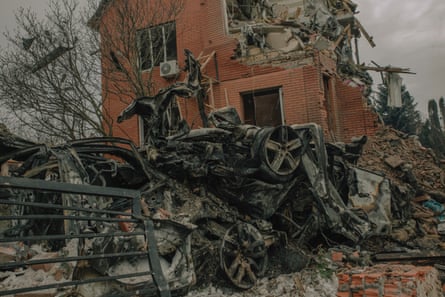 Bombed-out cars in a Kyiv street