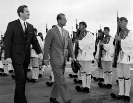 King Constantine II of Greece and his cousin Prince Philip reviewing the Greek royal guard at Athens airport in 1965.