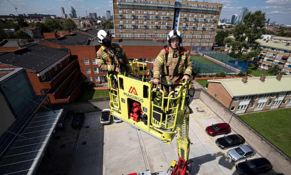 Andy Roe, commissioner of London fire brigade on a new 32-metre ladder and fire engine.