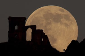 Wolf Moon rises over Mow Cop Folly, in Cheshire